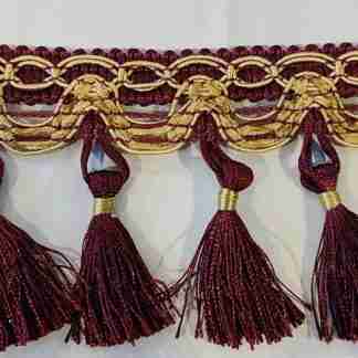 Passamaneria bordeaux e giallo oro con nappe